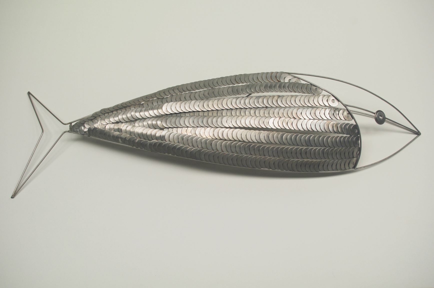 Stainless steel fish made from a lot of washers.